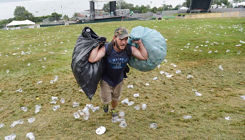 James Baldwin of Portland carries bags of returnables up the hill on the Eastern Prom last spring.