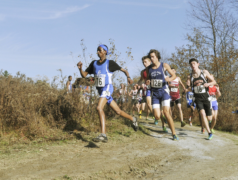 Mohamed Awil of Lewiston surges into the lead over Portland’s Ben Allen and Biddeford’s Cam Nadeau, the eventual winner, early in the Class A boys’ race.