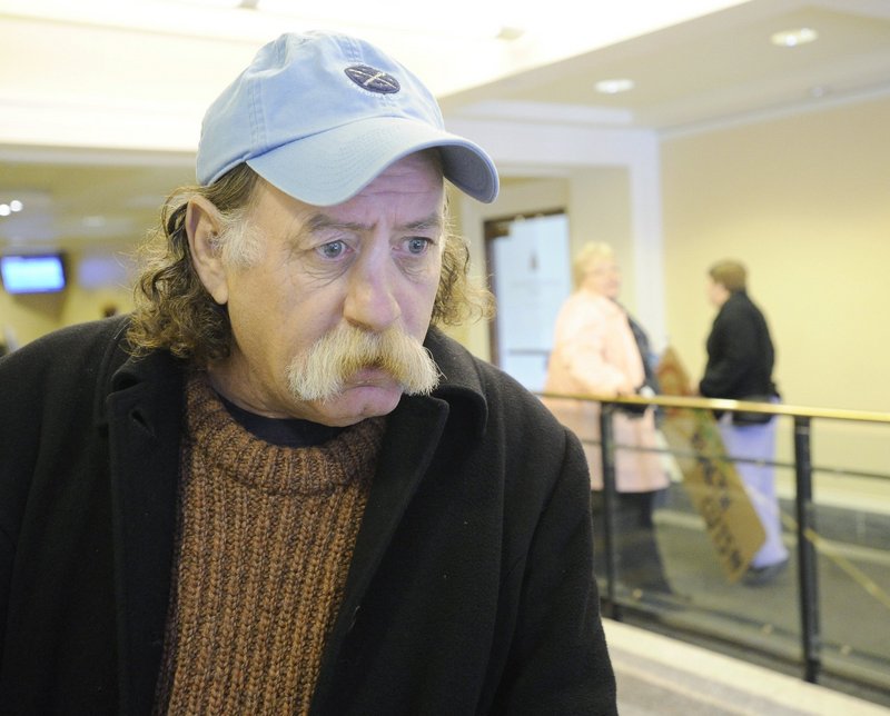 Steve Huston of Portland waits at the State House in Augusta to speak against cuts in health care last December. He died unexpectedly Thursday.