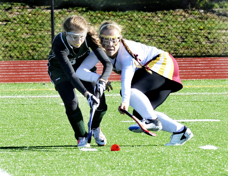 Bonny Eagle's Alexis Lambert and Thornton's Kaitlin Hilton fight for the ball.