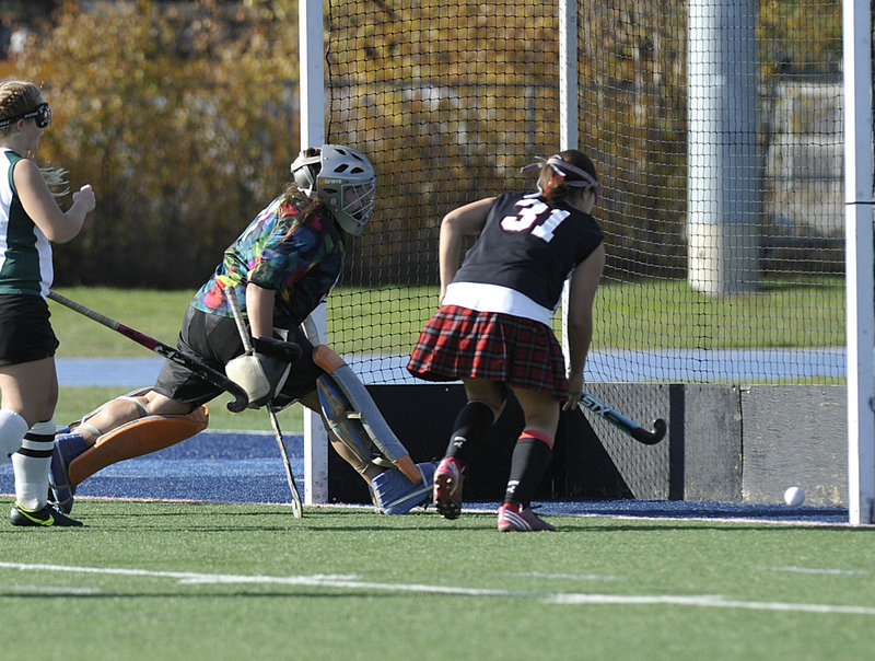 Arianna Kahler, 31, of Lisbon follows her goal as Winthrop goalie Alyssa Arsenault reacts too late in the first half of the Class C State Championship game at Orono.