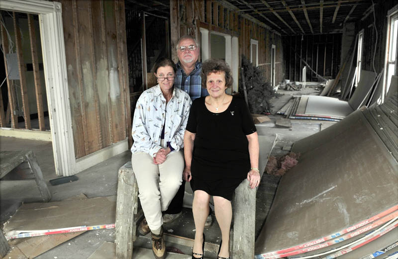 Carol Dyar-Eaton, left, and Erwin and Shirley Emery, inside their planned veterans shelter, in downtown Madison, on Wednesday.