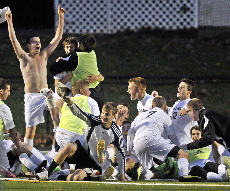 Boisterous Bulldogs celebrate Thursday’s 1-0 victory over Waynflete in Western Class C playoff action. Hall-Dale advances to the state championship game against Houlton Saturday.