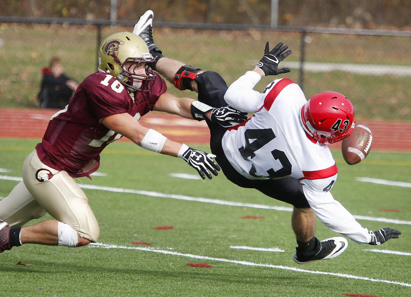 Andrew Libby, left, breaks up a pass intended for Scarborough’s Kenny Adams during Saturday’s Western Class A semifinal won by Thornton Academy, which advances to the regional final against Cheverus.