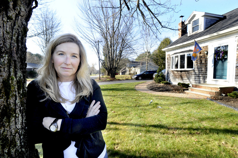 Amy Williams, a neighbor of the public works garage, questions the wisdom of spending $375,000 to acquire an adjacent house to create 11 parking spots.