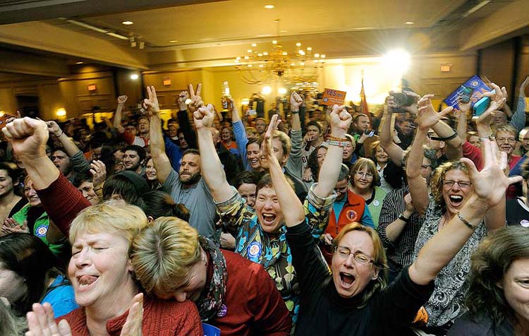 People celebrate after learning same sex marriage had passed at the Mainers United for Marriage party at the Holiday Inn by the Bay Tuesday, November 6, 2012. The city of Portland will open City Hall at midnight Dec. 29 to give out marriage license and perform the first same-sex weddings in the state.