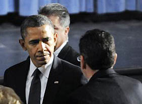 President Barack Obama greets Gov. Dannel Malloy at the start of an interfaith vigil for the victims of the Sandy Hook Elementary School shooting on Sunday.