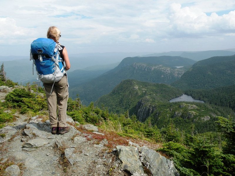 A vast expanse of high summits, alpine tundra, dramatic escarpments, deep valleys, old growth forests and pristine waters can be seen from Pic du l’Aube on the IAT Gaspe.