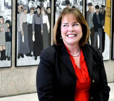 Jeanne Paquette, Maine's commissioner of labor, unveiled the labor murals on display on the wall of the Maine State Museum in 2013.