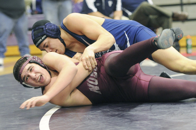 Jamal Durrani of Noble looks for the sideline while competing against Malcolm Henry of Portland in the 182-pound class. Henry won, then captured the consolation final.