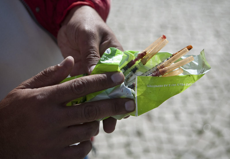 A drug addict holds used needles to exchange for new ones in Portugal, which decriminalized drug use in 2000. A reader says that Gov. LePage’s prison expansion plan highlights the need to review U.S. drug laws so that nonviolent drug offenders don’t continue to crowd our prisons.