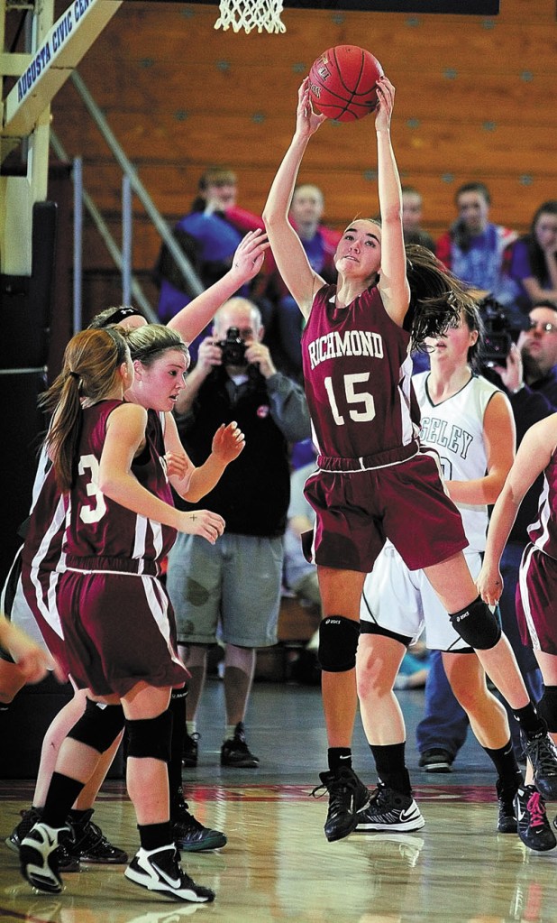 Richmond's Jamie Plummer pulls in a rebound during the Western Maine Class D girls championship game on Saturday at the Augusta Civic Center.