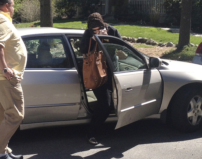 In this Sunday, April 21, 2013 photo, Katherine Russell Tsarnaev, center, wife of killed Boston Marathon bombing suspect Tamerlan Tsarnaev, exits a car at the home of her parents in North Kingstown, R.I. At left is her father, Warren Russell. (AP Photo/Katie Zezima) Boston Marathon Bombing Tsarnaev