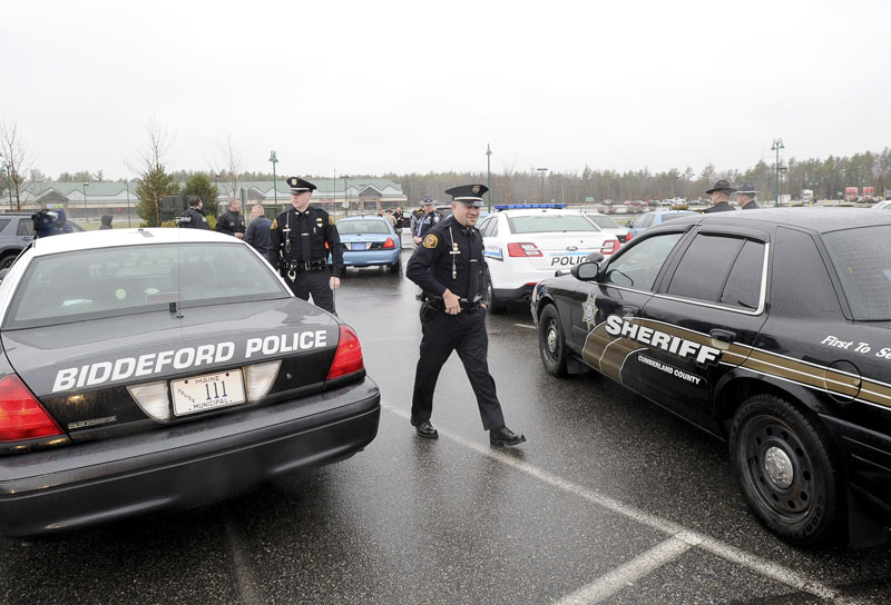 Police officers from across Maine assemble at Cabela's in Scarborough Wednesday, April 24, 2013 for the drive to Boston to honor Sean Collier, an officer at MIT, who was shot by one of the marathon bombing suspects.