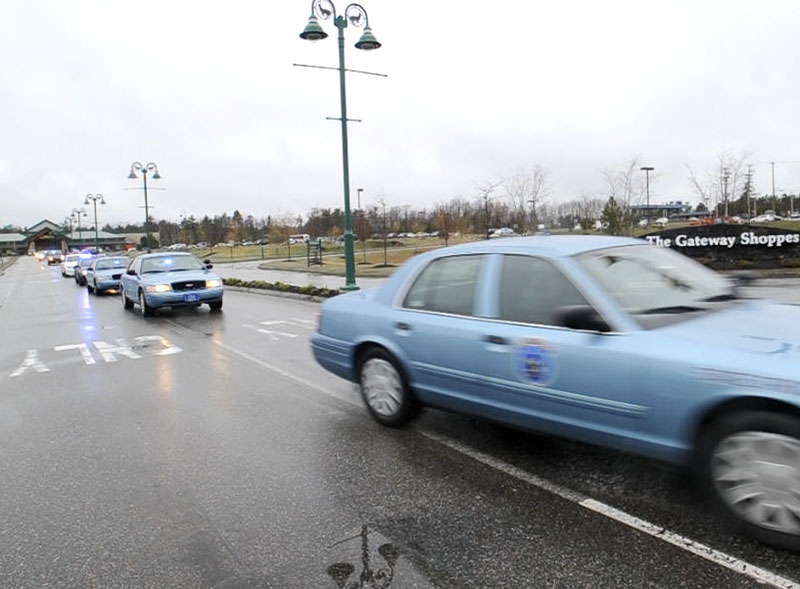 Police officers from across Maine leave Cabela's in Scarborough on Wednesday, April 24, 2013 for the drive to Boston to honor Sean Collier, an officer at MIT, who was shot by one of the marathon bombing suspects.