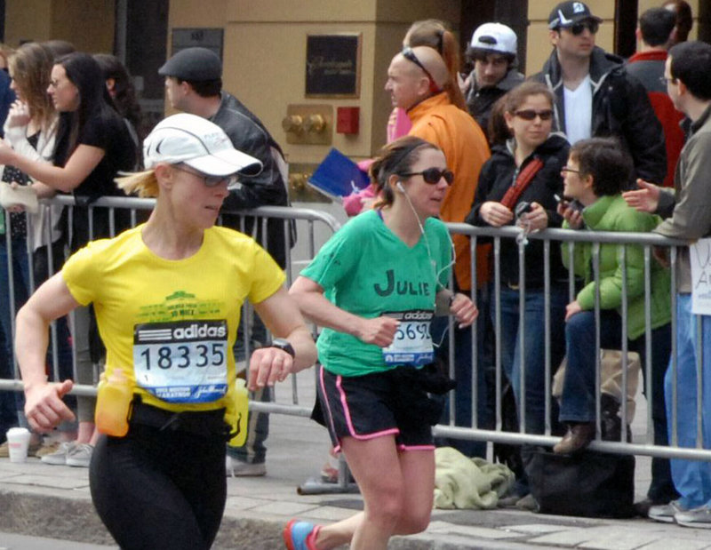 In a photo provided by amateur photographer and Taunton, Mass., resident Bob Leonard, suspects Dzhokhar and Tamerlan Tsarnaev are clearly visible in the background, side by side and wearing baseball caps.