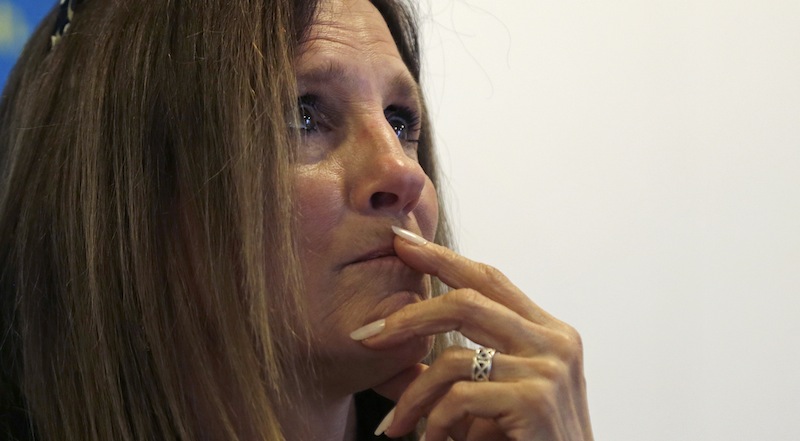 Boston Marathon explosion survivor Beth Roche, of Highland, Ind., pauses while describing the moments she was injured following the explosion near the finish line of the Boston Marathon, at the Spaulding Rehabilitation Hospital in Boston, Tuesday, May 28, 2013. Roche said she is hoping to meet a man who helped her at the bombing scene, who she has yet to find, before her hospital discharge later this week. (AP Photo/Charles Krupa)