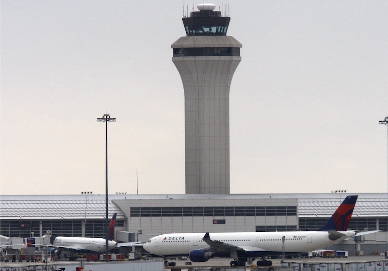 This Dec. 26, 2009, file photo shows jets outside Detroit Metropolitan airport in Romulus, Mich. Hussain Al Kwawahir, arrested Saturday at the airport after lying about why he was traveling with a pressure cooker, is set to be arraigned Monday, May 13, 2013, in federal court in Detroit. The Saudi man is accused of using a passport with missing pages and lying to Customs and Border Protection agents. (AP Photo/Carlos Osorio, File)