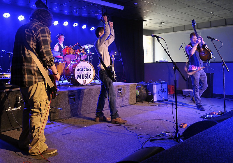 The band Rupture the Fish performs in the finals of the MAMM Slam teen band competition at the Asylum in Portland. From left are Spencer Teachout, bass; Ben Nason, drums; Eamon Kelley, guitar; and Scott Ralston, guitar and lead vocals.