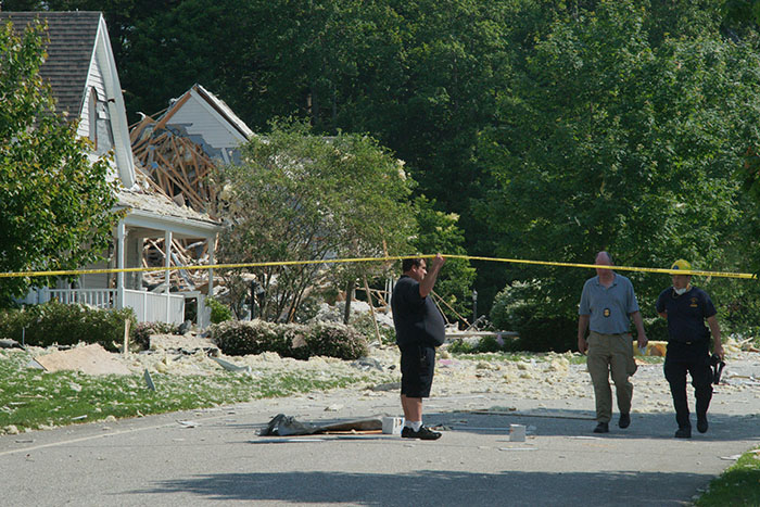 Firefighters inspect houses on Gables Drive.