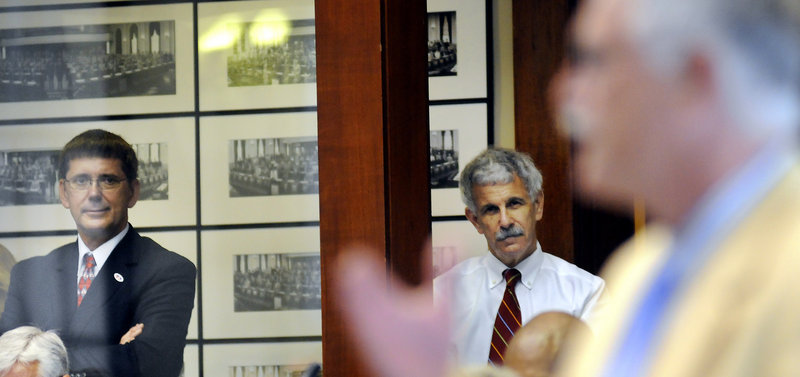 Maine Senators John Patrick, left, D-Rumford, and Roger Katz, R-Augusta, watch the debate in the House of Representatives on Wednesday, June 26 to override Gov. Paul LePage's veto of the state budget. Both senators voted to overturn the veto.