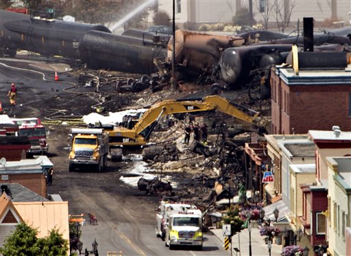 Searchers dig through the rubble for victims of the inferno in Lac-Megantic, Quebec, Monday.