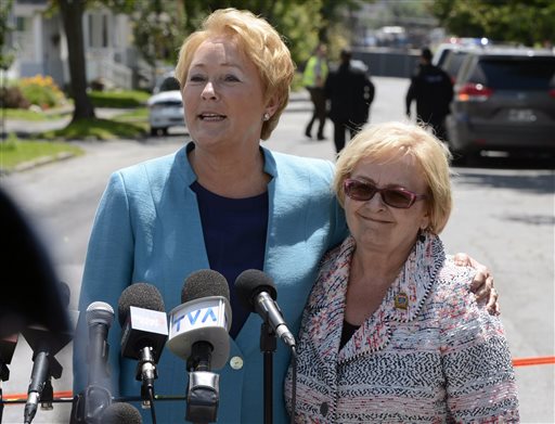 Quebec Premier Pauline Marois, left, and Lac-Megantic Mayor Colette Roy-Laroche speak during a news conference Thursday in Lac-Megantic, Quebec.