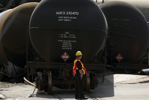 In this July 12 file photo, work continues at the crash site on in Lac-Megantic, Quebec of a train that derailed igniting tanker cars carrying crude oil that killed fifty people. U.S. Reps. Mike Michaud and Chellie Pingree of Maine continued to press Wednesday, July 31, 2013 for stronger safety standards for tanker rail cars during a meeting with the head of an agency that oversees the transportation of hazardous materials. (AP Photo/The Canadian Press, Ryan Remiorz)