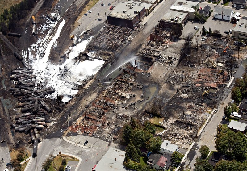 Wreckage is strewn through the downtown core in Lac-Megantic, Quebec, Monday, July 8, 2013, after a train derailed, igniting tanker cars carrying crude oil early Saturday. (AP Photo/The Canadian Press, Ryan Remiorz)