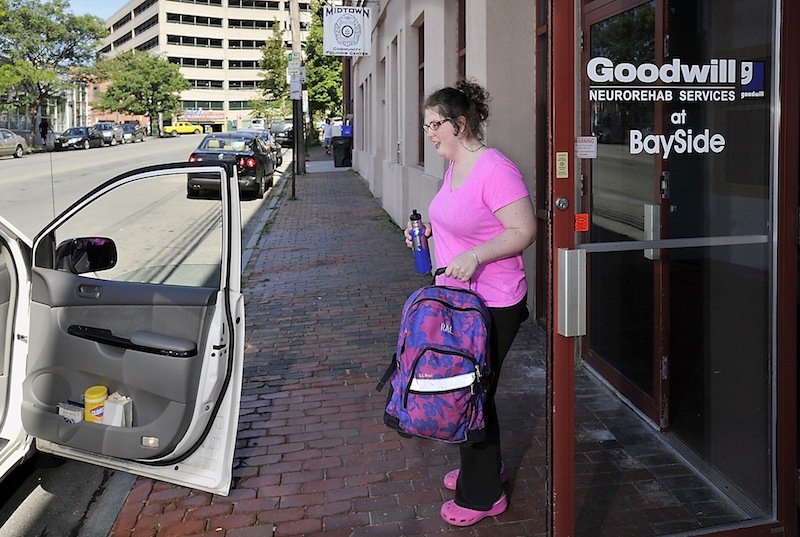 Rebecca Lee gets a ride home from her father from the Goodwill Neurorehab Services at Bayside after her regular MaineCare-funded ride failed to show because of a "medical emergency" on Wednesday, Aug. 7, 2013.