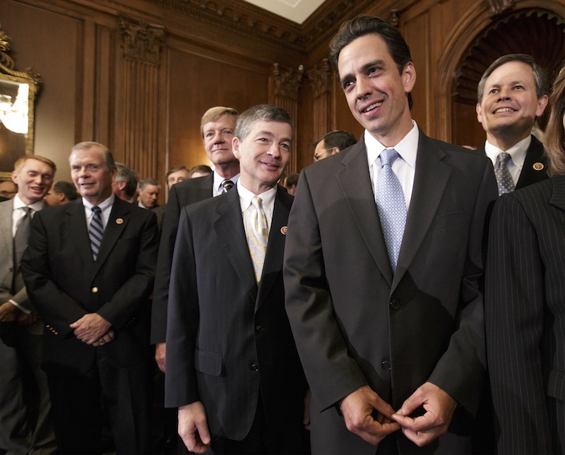 Rep. Tom Graves, R-Ga., right, stands with Rep. Jeb Hensarling, R-Texas, left, and fellow Republicans after the Republican-controlled House passed a bill that would prevent a government shutdown while crippling the Affordable Care Act.