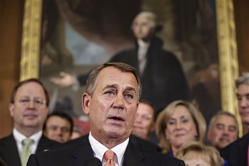 Speaker of the House John Boehner, R-Ohio, and Republican members of the House of Representatives rally after passing a bill that would prevent a government shutdown while crippling the health care law that was the signature accomplishment of President Barack Obama's first term, at the Capitol in Washington, Friday, Sept. 20, 2013. (AP Photo/J. Scott Applewhite)