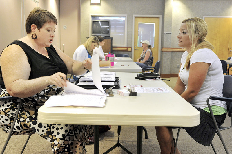 Margaret Tibbetts, left, a Bonney Staffing Center supervisor, interviews Marlanda Wing of Westbrook during a recent job fair.