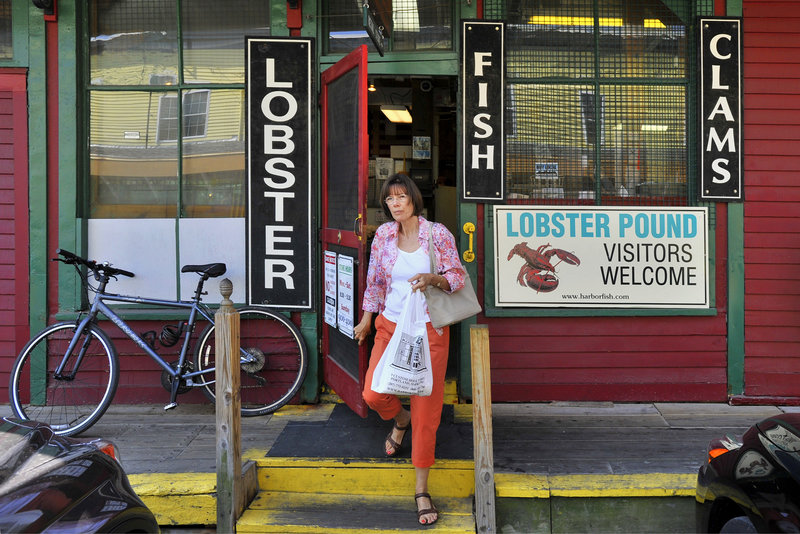 Alice Hamilton of Scarborough, a regular, exits the Harbor Fish Market.