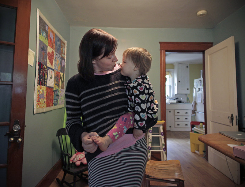 Erika Burkhart and her 18-month-old daughter, Lumi Stone, spend time together in their Portland home.