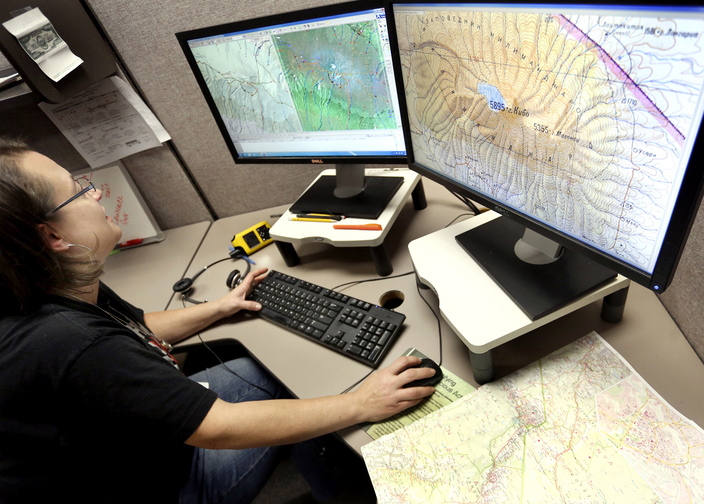 Kirsten Boettcher, GIS technician at DeLorme, uses track points from an inReach to enhance data on her computer of Mount Kilimanjaro.