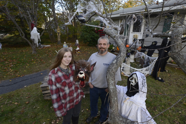 John Robertson and his daughter Isabel, 15, have created a haunting scene in front of their Cape Elizabeth home.