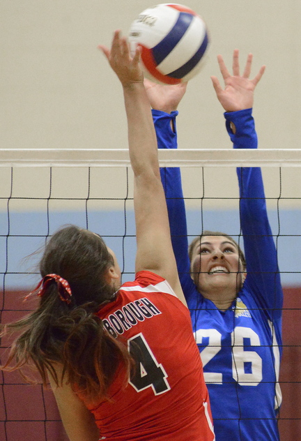 Megan Tamarro, right, of Falmouth was reluctant to switch positions and move to setter. But to win a state championship, her team needed her to move. And win the title was what Falmouth did.