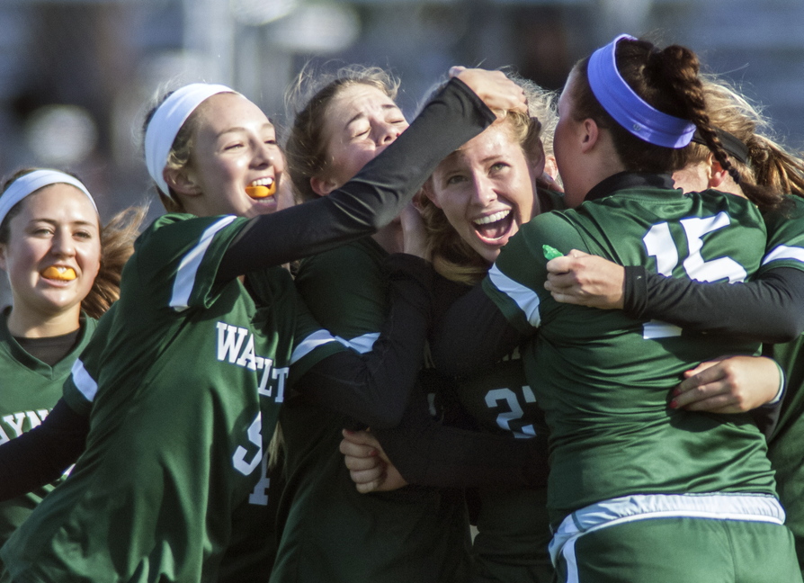 Marijke Rowse of Waynflete receives a pat on the head and a whole lot more after scoring on a free kick late in the first half as the Flyers started a comeback from a 2-0 hole.