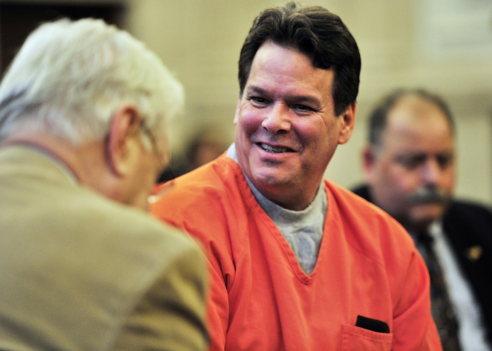 Gordon Chibroski/Staff Photographer. Thursday, November 7, 2013. Dennis Dechaine perks up as he chats briefly with a media writer who is a friend of his brother in Superior Court as the court was adjourned and before Dechaine was lead out out court.