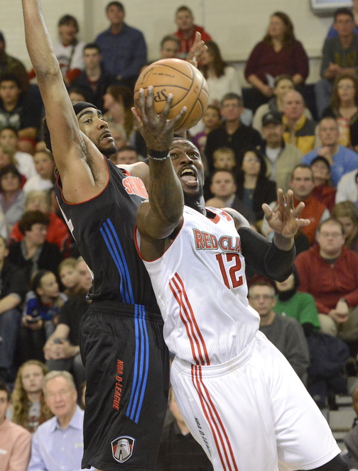 Maine’s Jermaine Taylor leans in for a shot against Springfield’s JamesOn Curry as the Red Claws hosted the Springfield Armor in the season opener at the Portland Expo on Friday.