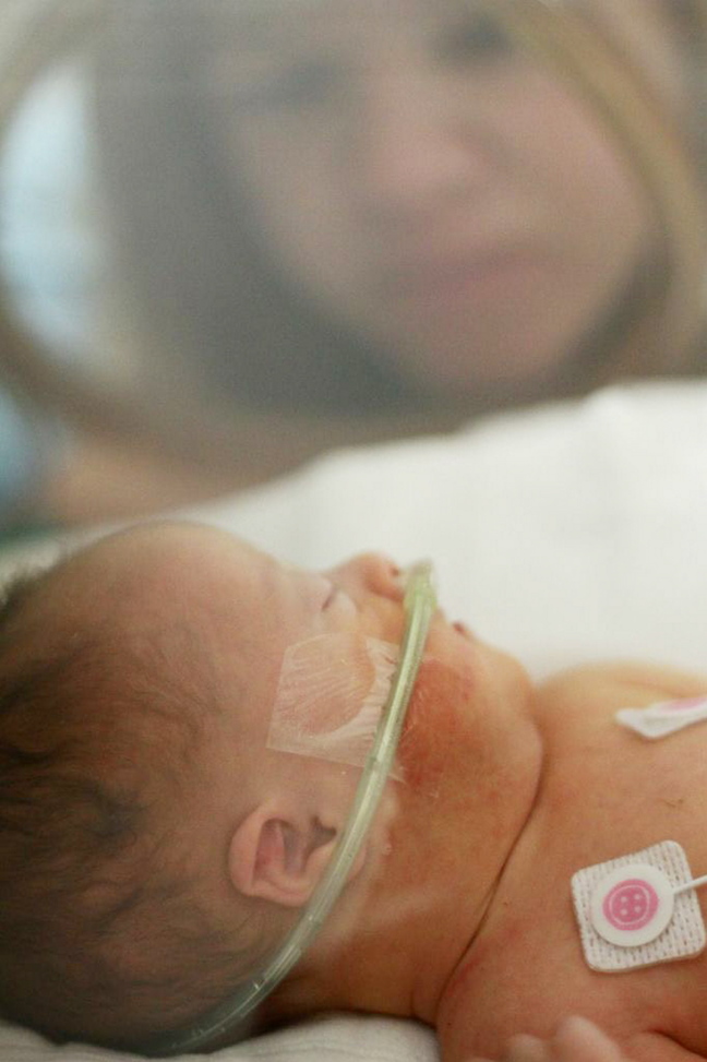 Nicole Wheeler visits her son Charlie in the intensive care unit at Maine Medical Center in Portland. The baby was born with Down syndrome and leukemia and died 17 days after he was born. “We didn’t have any other option than to have hope,” his mother said. “We had two (other) kids who needed us to be strong.”