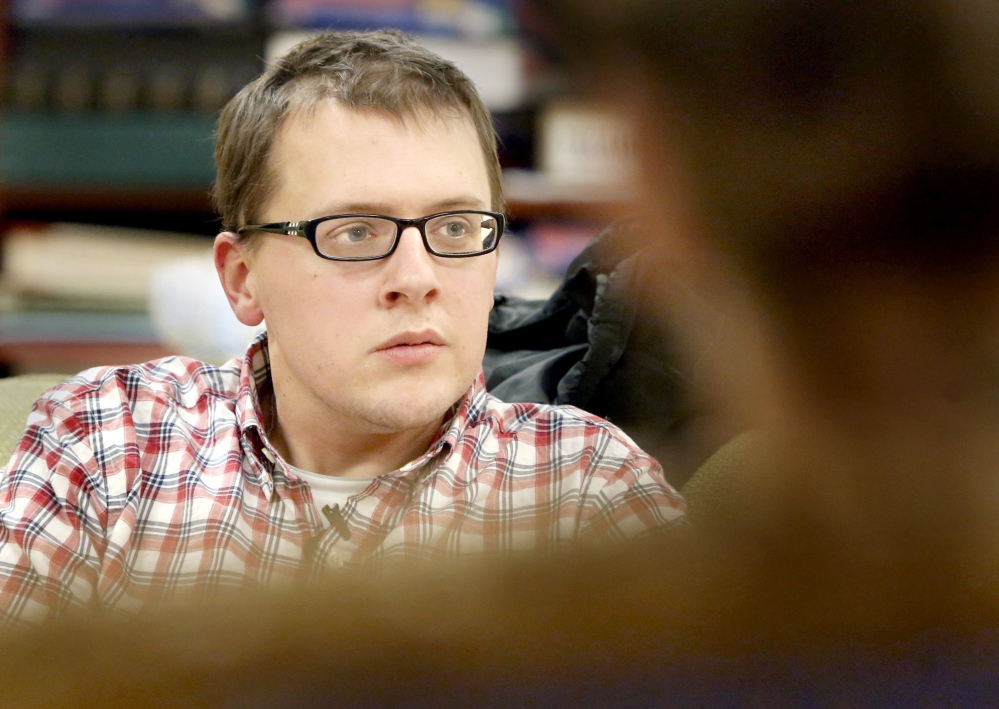 Tom Chalmers helps lead a session with young-adult survivors of cancer at the Cancer Community Center in South Portland. Chalmers was treated for a brain tumor at age 20, and afterward found post-cancer resources for young adults were scarce.