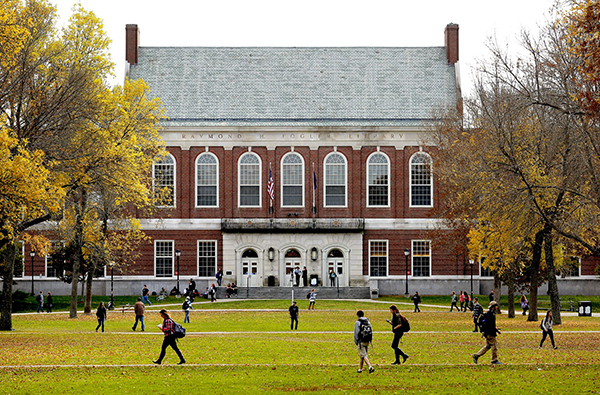 Students and faculty move through the mall at the University of Maine on a fall afternoon in October 2013.