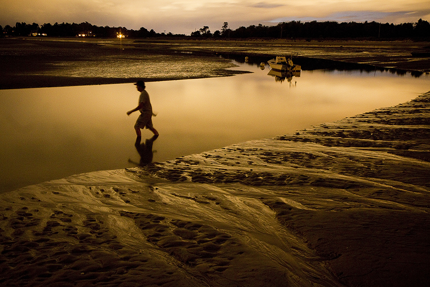 Lights shine across the water in Scarborough in this 2013 photo. As a result of a court decision, homeowners will no longer receive tax breaks on adjacent lots. 