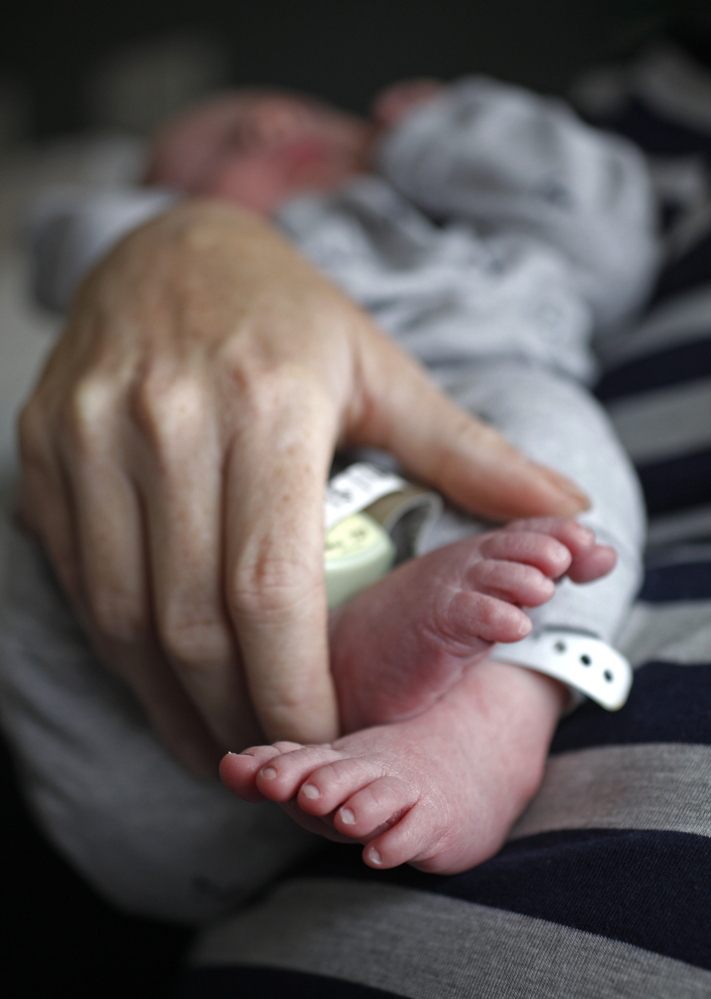 Ondrea Gallivan, 41, holds her newborn son, Aaron Thomas Gallivan, at Maine Medical Center in Portland on Friday. Gallivan joins a growing number of women 35 and older who are experiencing childbirth for the first time. “It was a long journey,” she says, “but we’re here.”