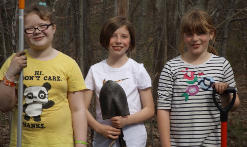 Junior Girl Scouts Emma Brackett, left, Megan Cunningham, center, and Ella Pillsbury have been named candidates for the Girl Scout Bronze Award after leading a spring cleanup day at the Grand Trunk Cemetery in Portland. Along with volunteers from other Girl Scout troops, family and friends, they planted two perennial gardens to honor early settlers of East Deering Village who are interred at a cemetery on the property. To learn more about the Grand Trunk Cemetery and the reclamation project, go to http://remnantgtc.blogspot.com.