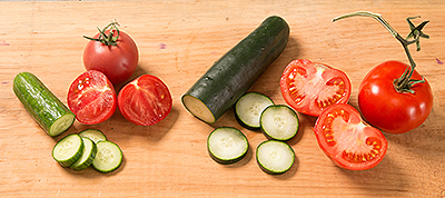 Olivia’s Garden tomatoes and cucumber purchased at the farmers market, left, and Shaw’s vegetables, right. In her comparison, writer Susan Axelrod found that her money went further at Shaw’s – “everything I bought was simply bigger.”