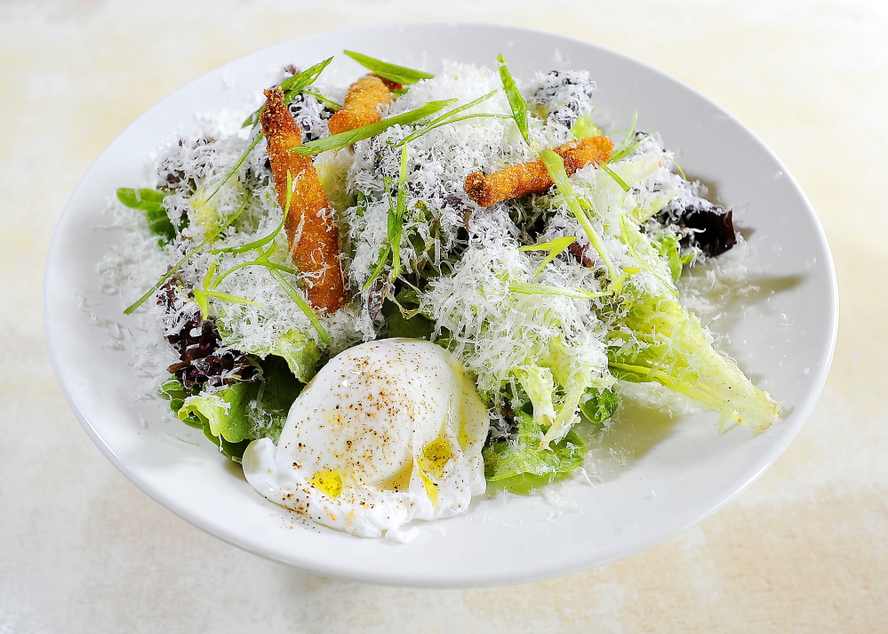 Local greens with green goddess dressing, fried anchovies, fresh grated parmesan and a poached egg.