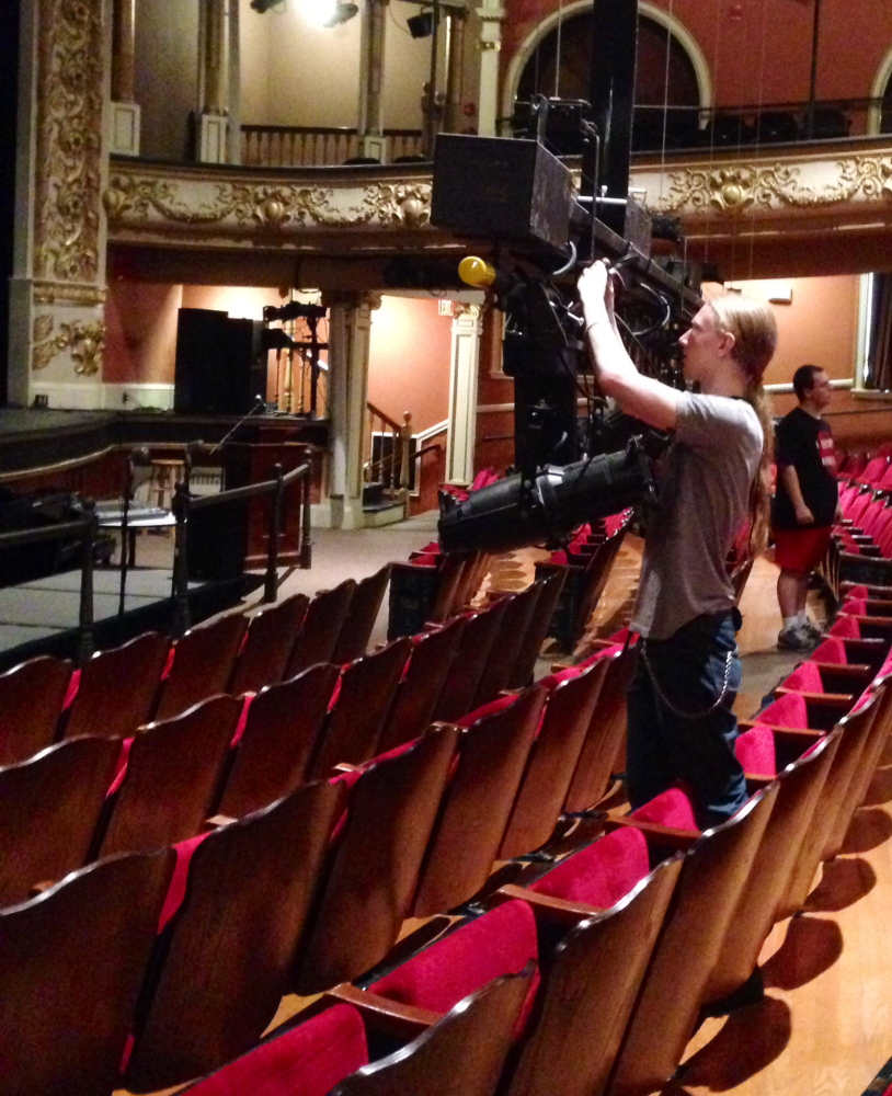 Isaac Woods, a tech assistant at the Opera House, completes preparations for the Maine International Film Festival. Jesse Scardina/Morning Sentinel